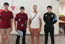 Salah satu WNA tengah diantar oleh petugas imigrasi untuk dideportasi.